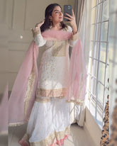 White Soft Georgette Embroidery Work Gharara Suit With Pink Dupatta